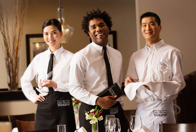 Image of food servers wearing uniforms
