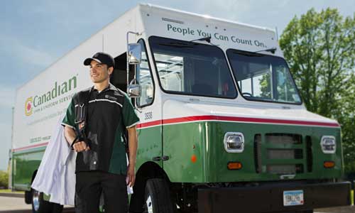 Canadian Linen truck with man delivering uniforms