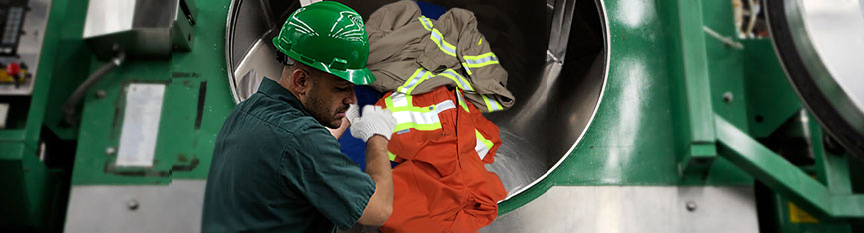 Man loading laundry into industrial washer