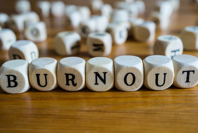 image of scrabble blocks spelling out Burn Out