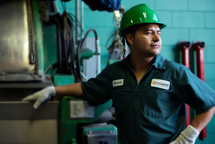 image of man at laundry washing machine industrial size