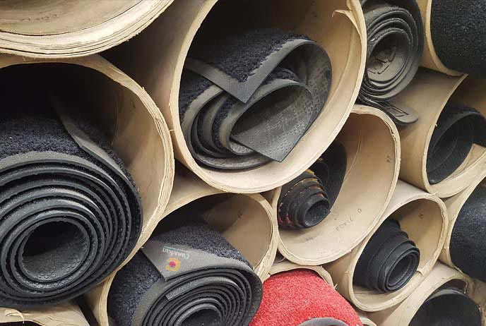 Image of rolled up mats of all kinds