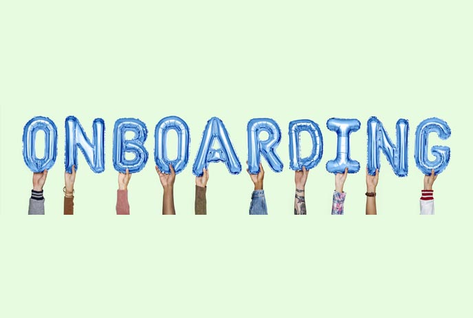 image of people holding up onboarding sign