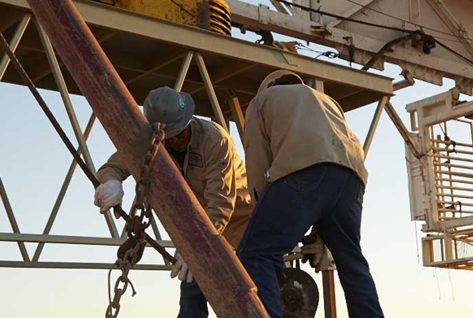 image of oil workers