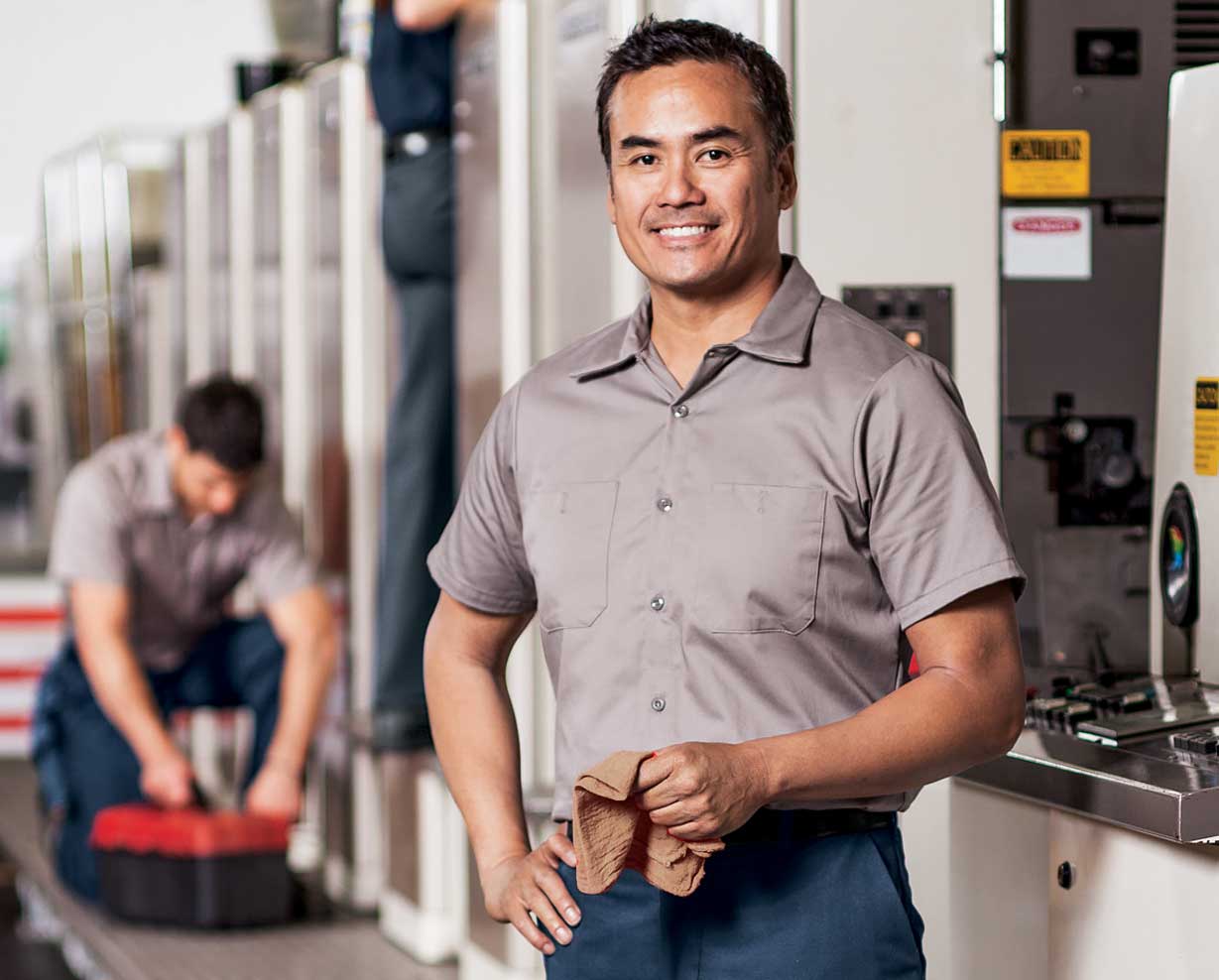 Image of man working with shop towels