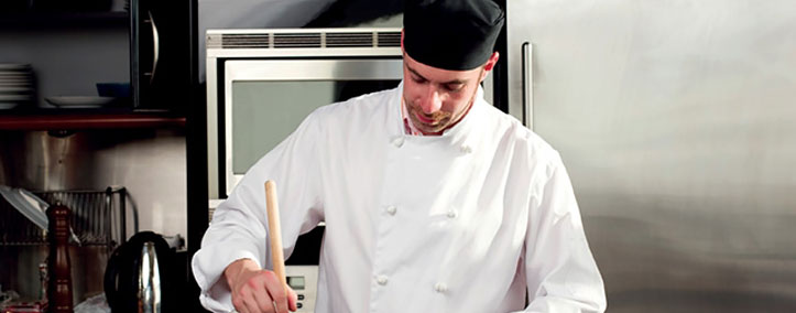 Chef wearing chef coat as restaurant uniform in kitchen